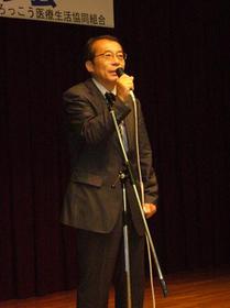 粟原富夫さんによる主催者あいさつA.JPG